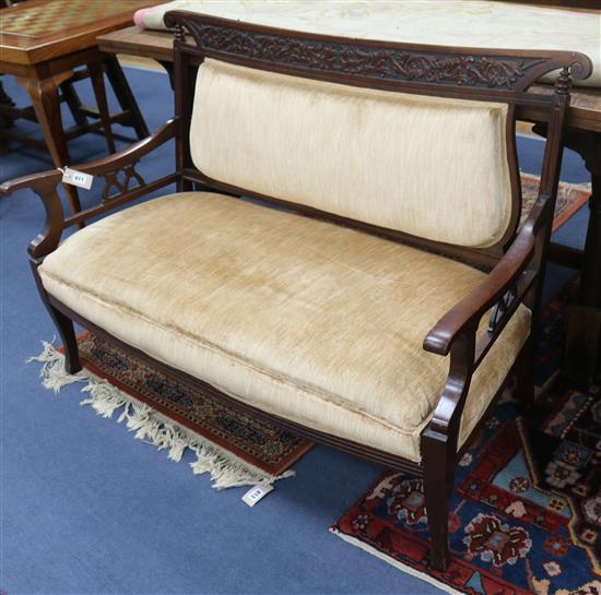 An Art Nouveau carved framed upholstered settee W.124cm